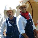 Two Men in Overalls and Cowboy Hats